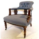 An Edwardian mahogany framed salon chair, with three pierced roundel splats,