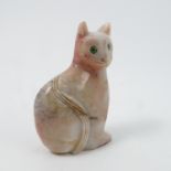 A carved hardstone model, of a seated cat, in pink and white stone, with green eyes, height 2.