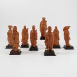 Eight carved wooden models, of the Immortals, on wooden bases, height 6.