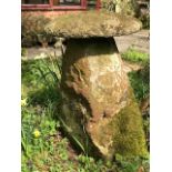 A staddle stone and cap,