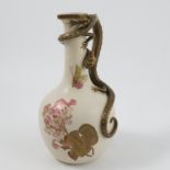 A 19th century Royal Worcester gilded ivory jug, with mythical beast moulded handle,