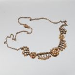 A seed pearl necklace, the crescent and star motifs frontispiece with fringe between, 45cm long, 11.