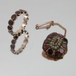 A 19th century garnet ring, set with fourteen flat cut stones, finger size N, 1.