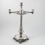 A silver plated three light candelabrum, having two pierced branches,