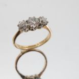 A three stone diamond ring, stamped 'Fine Plat' and '18ct',