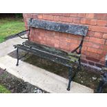 A wrought iron garden bench, of branch like form, width 47ins,