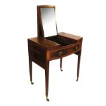 A late Georgian mahogany bow front dressing table,
