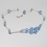 A gilt metal and blue paste necklace
