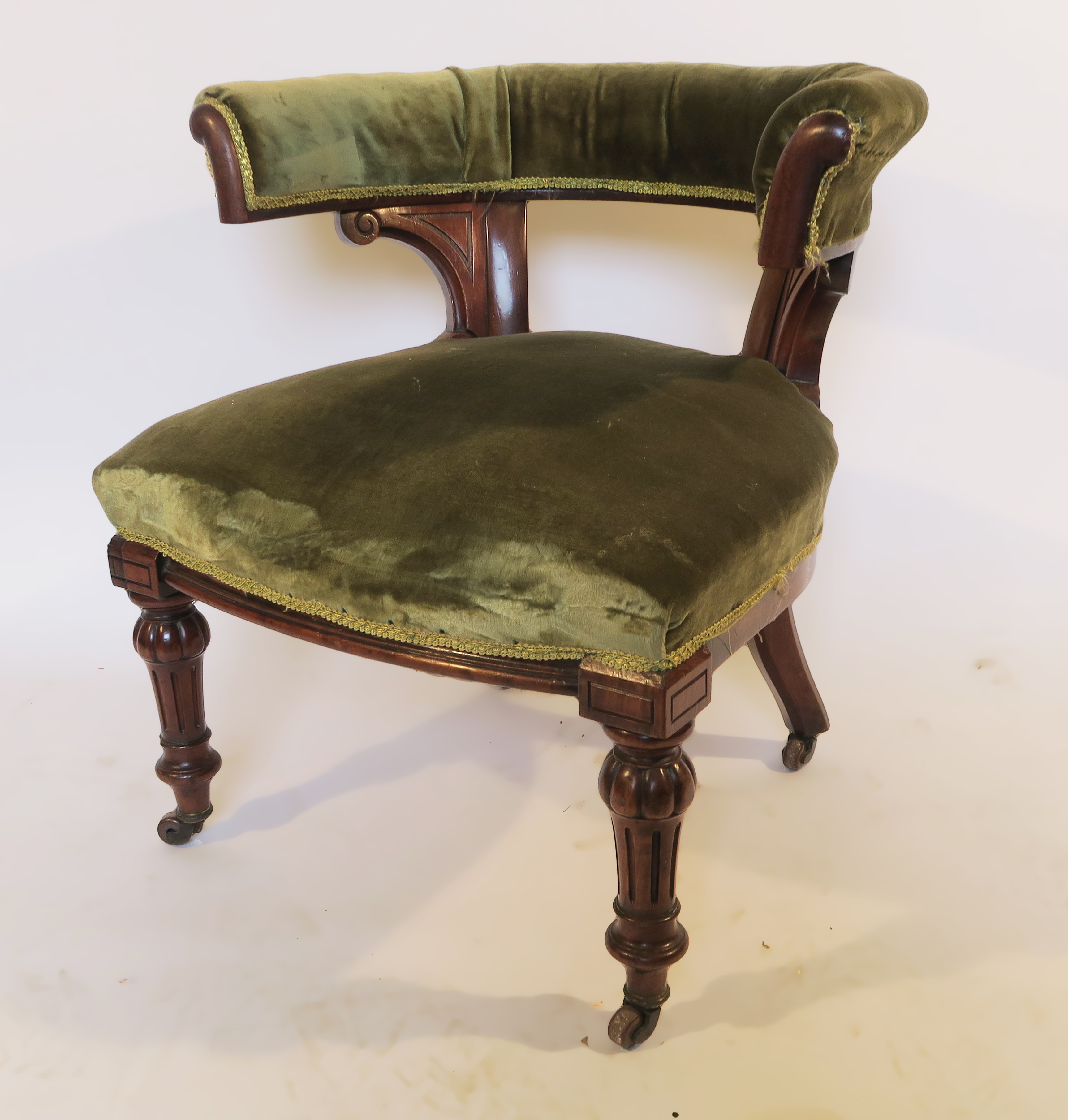 A Victorian mahogany club chair, with hoop back,