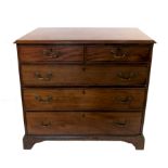 A Georgian mahogany chest, of two short drawers over three graduated long drawers,