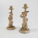 A pair of Royal Worcester Hadleys blush ivory candlesticks,