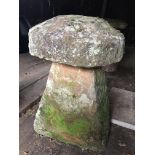 A staddle stone and cap