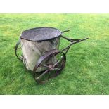 A garden galvanised water bowser,