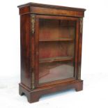 A Victorian walnut pier cabinet, having glazed door with marquetry and gilt metal mounts,