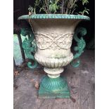 A large cast iron garden urn, with moulded body and double scrolling handles, height 29ins,