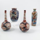 A pair of Imari pattern vases, the bulbous bodies with slender necks, height 8ins,