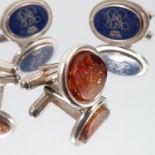 A pair of amber coloured stone set cufflinks, and a pair with a cypher,