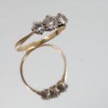 A three stone diamond ring, indistinct marks,