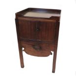 A Georgian mahogany bedside commode, with tray top,