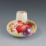 A Royal Worcester squat form vase, hand painted with autumn berries and leaves, signed K Blake,
