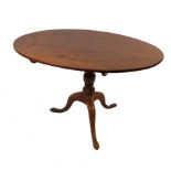 A 19th century oval mahogany centre table, raised on a turned column and tripod base,