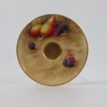 A Royal Worcester saucer, decorated with fruit to a mossy background by H Aryton,