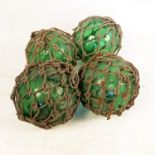 A collection of green glass fishing weights,
