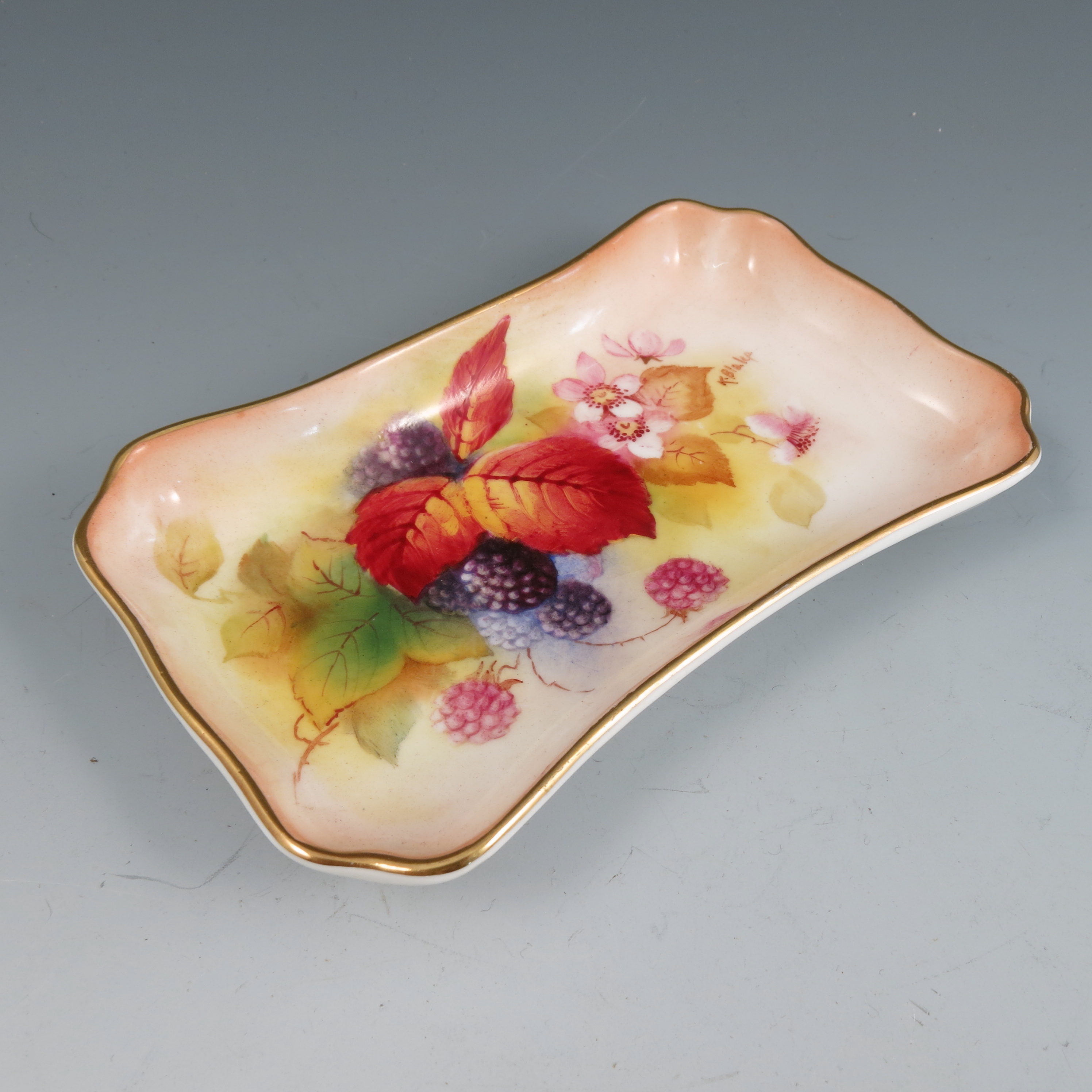 A Royal Worcester rectangular waisted tray, with canted corners and gilded border,