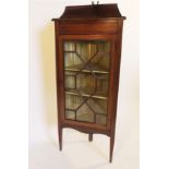 A mahogany free standing corner cupboard, with astragal glazed door,