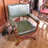 A mahogany and upholstered cross frame chair,