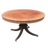A 19th century mahogany circular breakfast table, raised on a turned column with four outswept feet,