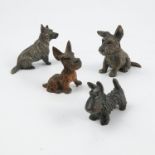 Four cold painted bronzes, modelled as dogs, three seated and one standing, one stamped Austria,