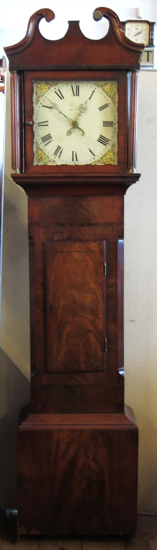 An Antique mahogany cased long case clock, with square painted dial,