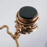 A 9 carat gold two sided swivel seal fob, on a 9 carat gold chain, 8.