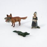 A cold painted bronze model, of a fox with a duck in its mouth, marked Geschutzt, height 2ins,