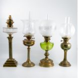 Four brass and glass oil lamps, a Hinks No.