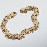 A bracelet, stamped '750', with two colour fancy links, 22.