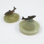 Two cold painted bronze models, of rainbow trout, mounted on green onyx circular bases, diameter 3.