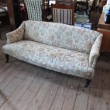 A late Victorian upholstered settee,