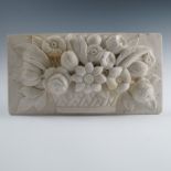 A white marble rectangular panel, relief carved with flowers in a basket,