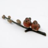 A cold painted bronze model, of two robins perched on a pussy willow branch, length 6ins, height 1.