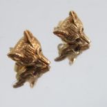 A pair of 9 carat gold fox mask ear studs, ruby set eyes, one vacant, 4.