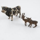 A cold painted bronze model, of a bull, height 2.25ins, length 3.