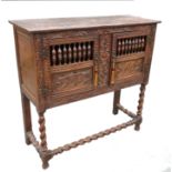 A 17th century style oak cupboard,