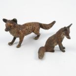 A cold painted bronze model, of a fox, height 2.5ins, length 5.
