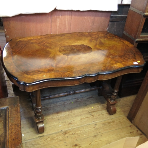 A Victorian walnut centre table, of shaped rectangular form, with inlaid line decoration,