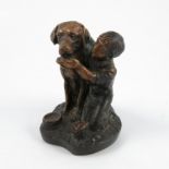 A bronze model, of a child kneeling next to a dog feeding it from a bowl, marked Sculpt, height 4.