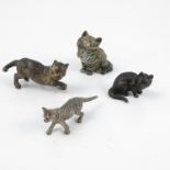 Four cold painted bronzes, modelled as cats in various poses,