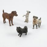 Four cold painted bronzes, modelled as dogs, one begging, height 2.