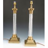 A pair of Vaughan brass and glass Corinthian column table lamps,